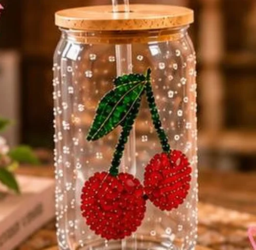 Glass tumbler bedazzled with a red rhinestone cherry design and pearls